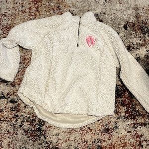 White furry pull over